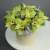 Композиция в шляпной коробке из 11 лаймовых орхидей в Раменском